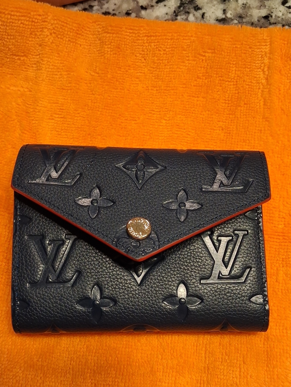 Embossed Monogram Compact Wallet in Black